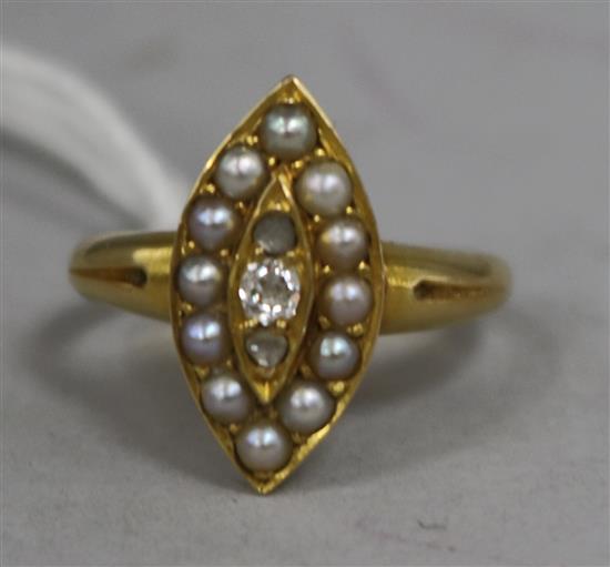 An Edwardian yellow metal, split pearl and diamond marquise shaped ring, size K.